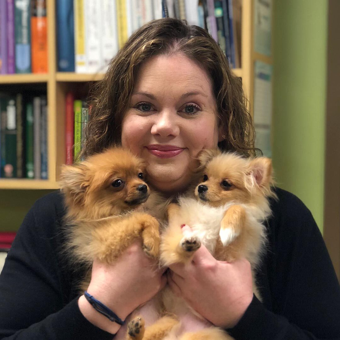 Team Member With Two Small Dogs